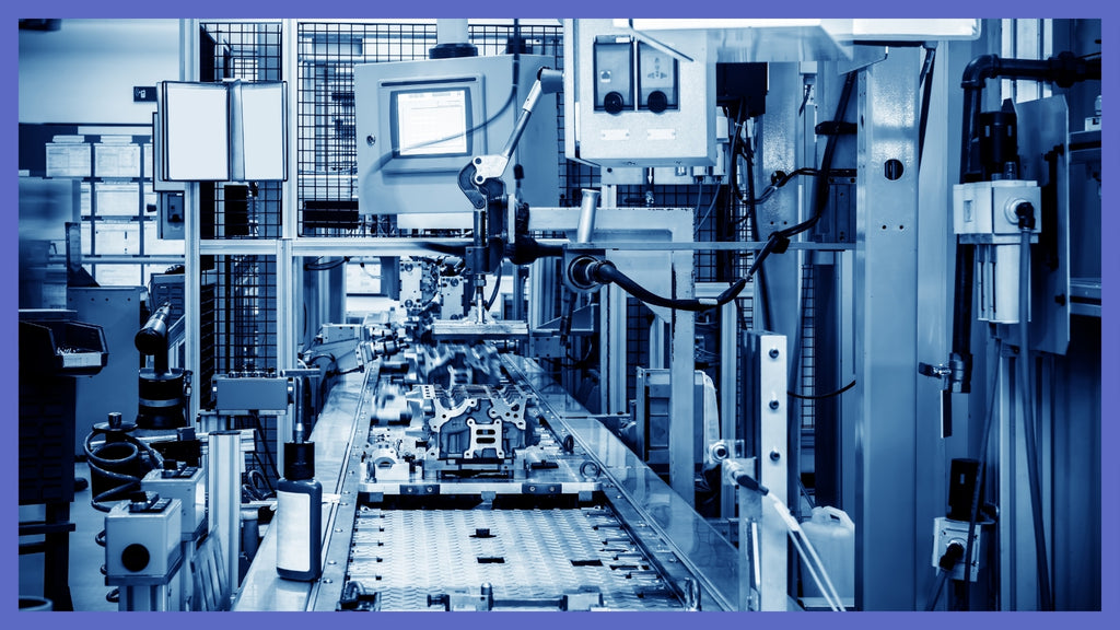 Automated production line with industrial control equipment in a manufacturing plant.